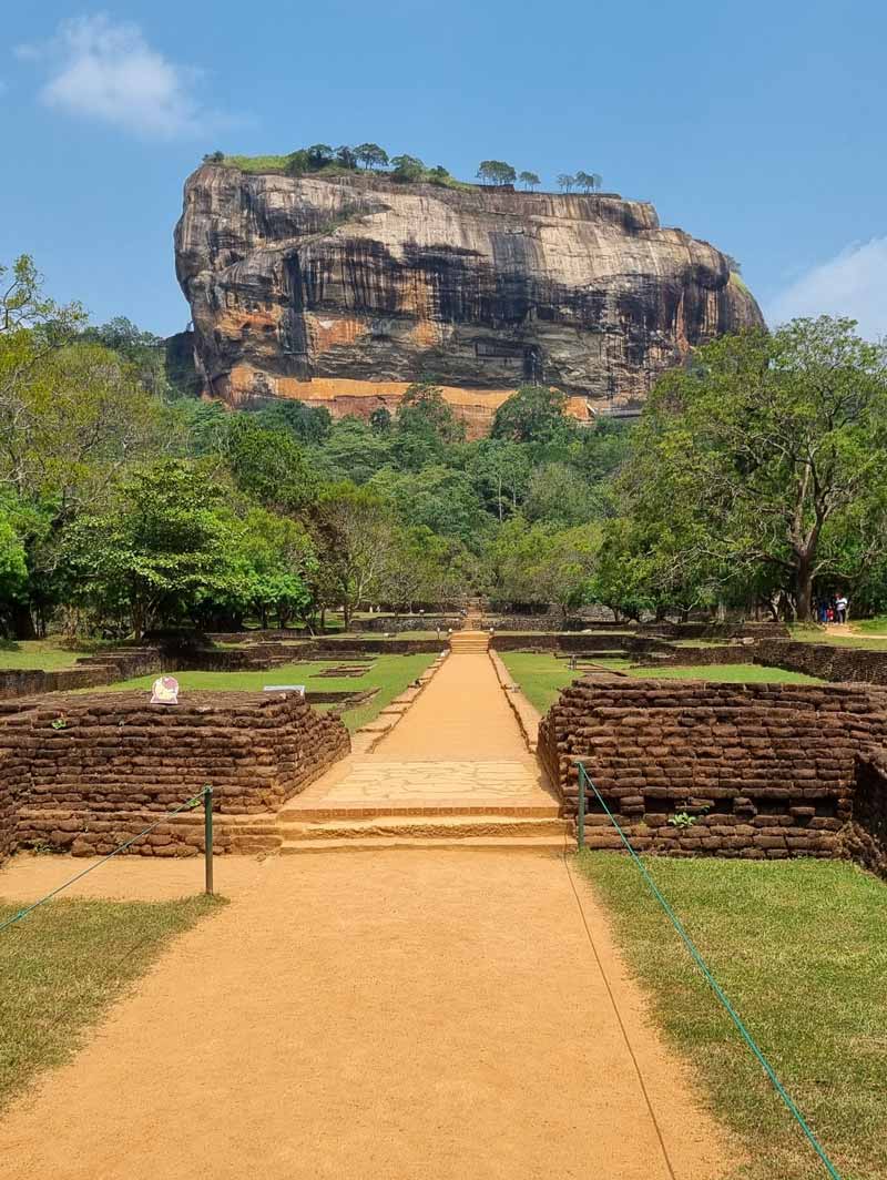 Sigiriya, also called Lion Rock, is a site in central Sri Lanka consisting of the ruins of an ancient stronghold that was built in the late 5th century CE on a remarkable monolithic rock pillar. The rock, which is so steep that its top overhangs the sides, rises to an elevation of 180 metres above the surrounding plain. It takes 30-60 minutes and 3 litres of sweat to climb to the top when you climb it at the warmest time of the day… 🥵🌞 Sigiriya, also called Lion Rock, is a site in central Sri Lanka consisting of the ruins of an ancient stronghold that was built in the late 5th century CE on a remarkable monolithic rock pillar. The rock, which is so steep that its top overhangs the sides, rises to an elevation of 180 metres above the surrounding plain. It takes 30-60 minutes and 3 litres of sweat to climb to the top when you climb it at the warmest time of the day… 🥵🌞