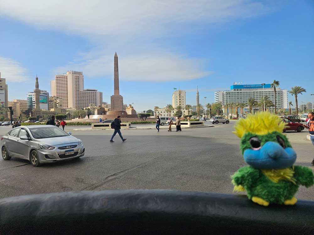 Arrived in Egypt! Eddie posing in front of Tharir Square where the Egyptian Revolution started in 2011.
